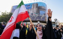 An Iranian woman at a rally protesting US strikes on nuclear sites, in Tehran