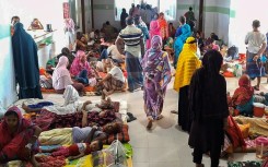 Dengue patients along with their family members are pictured at a hospital in Barguna in southern Bangladesh