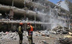 Israeli forces at the site of an Iranian missile strike in Tel Aviv