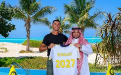 Cristiano Ronaldo (left) with Al Nassr's chairman Abdullah Al-Majid after signing a new deal
