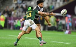 South Africa winger Cheslin Kolbe (L) tackles Barbarians centre Leicester Fainga'anuku at Cape Town Stadium