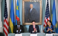 US Secretary of State Marco Rubio, Democratic Republic of the Congo Foreign Minister Therese Kayikwamba Wagner and Rwandan Foreign Minister Olivier Nduhungirehe applaud after signing a peace agreement in Washington