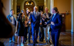 US Senate Majority Leader John Thune speaks to reporters as returns to his office from the Senate Chamber at the U.S. Capitol Building