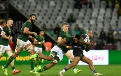 South Africa's Vincent Tshituka (L) tackles New Zealand's Jacob Ratumaitavuki-Kneepkens during the international rugby union match against the Barbarians in Cape Town