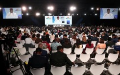 Delegates attend a plenary meeting at the UN 4th International Conference on Financing and Development in Seville on Monday