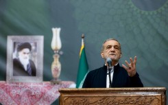 A handout picture shows Iran's President Masoud Pezeshkian giving an address in Tehran