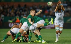 South Africa scrum-half Morne van den Berg (C) clears the ball against Italy in Pretoria