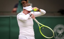 Barbora Krejcikova cries as she prepares to serve at Wimbledon