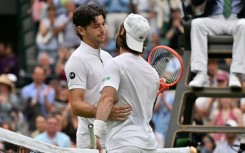 Australia's Jordan Thompson (right) was forced to retire from his Wimbledon fourth-round match against Taylor Fritz with an injury