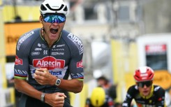Alpecin - Deceuninck team's Dutch rider Mathieu van der Poel cycles to the finish line to win the 2nd stage of the Tour de France