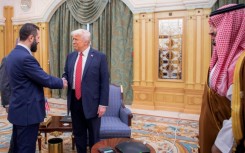 US President Donald Trump (C) met with Syria's interim president Ahmed al-Sharaa (L), a former Islamist guerilla commander, during a visit to Riyadh on May 14