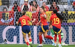 Alexia Putellas (C) celebrating with Esther Gonzalez (9) and Vicky Lopez (19) after scoring the opening goal for Spain against Belgium