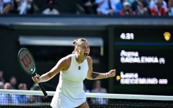 Aryna Sabalenka celebrates after beating Laura Siegemund at Wimbledon