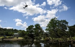 A search-and-rescue helicopter flies over Camp Mystic along the Guadalupe River in Hunt, Texas, where severe flash flooding over the Fourth of July holiday weekend left more than 120 people dead and another 170 missing