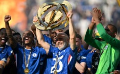 Chelsea coach Enzo Maresca lifts the trophy after his team beat Paris Saint-Germain in Sunday's Club World Cup final