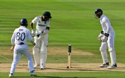 India's Mohammed Siraj (2L) can only watch as a ball from Shoaib Bashir spins back onto his stumps as Ollie Pope (L) and Jamie Smith (R) look on, as England win the third Test at Lord's by 22 runs