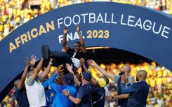 South African coach Rulani Mokwena (C) is lifted by Mamelodi Sundowns staff after winning the inaugural African Football League.