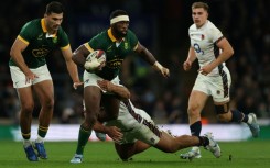 South Africa captain Siya Kolisi (C) in action against England at Twickenham last season.