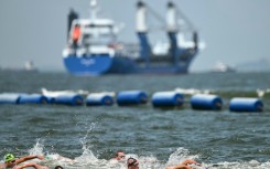 Swimmers compete in the men's 10km in the sea off Singapore
