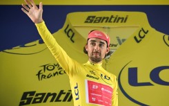 Irish rider Ben Healy holds the overall Tour de France leader's yellow jersey after the 11th stage in Toulouse, southwestern France