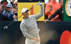 Rory McIlroy hit a wayward drive on the first tee