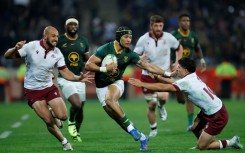 South Africa winger Edwill van der Merwe (C) bursts past Georgia defenders in Mbombela.