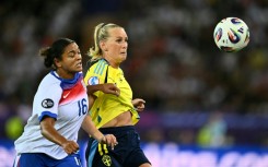 England defender Jess Carter (left) in action against Sweden at the Women's Euros