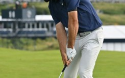 Scottie Scheffler responded to an eighth-hole double bogey with a birdie on the next green