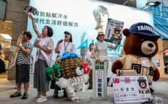 Supporters of a Taiwan recall vote shout 'Great recall, great success' in Taipei on July 22, 2025, ahead of recall elections this month
