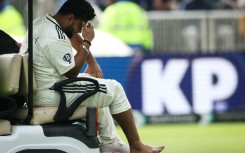 India's Rishabh Pant reacts as he leaves the field in a buggy after retiring hurt on 37 with a foot injury