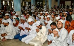 Muslims offer a special prayer at the Baitul Mukarram National Mosque in Dhaka for the victims of the plane crash