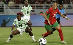 Nigeria midfielder Deborah Abiodun (L) watches as Morocco forward Sanaa Mssoudy chases the ball in Rabat