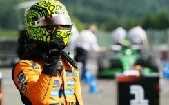 McLaren's British driver Lando Norris celebrates his pole position after the qualifying session ahead of the Formula One Belgian Grand Prix