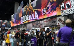 People throng a "Godzilla" display at Comic-Con