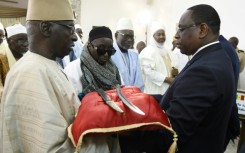 In 2019, France returned a 19-century sword to Senegal's then president Macky Sall (right)