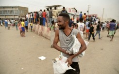 Looting erupted in Luanda on Monday, the first day of a strike against the rising prices of fuel