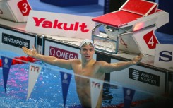 France's Leon Marchand broke the 200m medley world record at swimming's world championships in Singapore