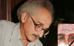 Renowned Egyptian novelist Sonallah Ibrahim, who died on Wednesday at the age of 88, is seen here at a Cairo book signing in September 2003.