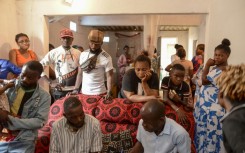 Relatives and friends of Silvia Mubiala mourn after she was allegedly shot by security forces during the unrest in the Angolan capital Luanda