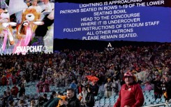 A public announcement warns of lightning during the third rugby Test match between Australia and the British and Irish Lions at Stadium Australia in Sydney