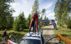 Finnish driver Kalle Rovanpera (R) won his home rally for the first time to raise his hopes of a third world title