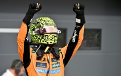 Lando Norris celebrates after fending off McLaren teammate Oscar Piastri in Hungary