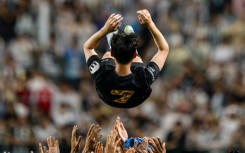 Teammates throw Tottenham Hotspur's captain Son Heung-min up in the air