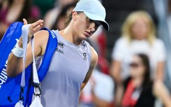 Wimbledon champion Iga Swiatek leaves the court after falling in the fourth round of the WTA Canadian Open