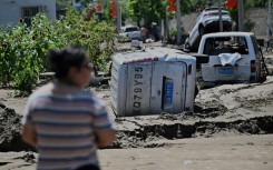 Damaged cars seen at the end of July in Huairou district, on the outskirts of Beijing after heavy rains caused widespread flooding