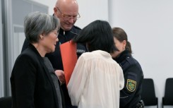 Defendant Yaqi X., seen from the back, at the start of the espionage trial in Dresden, eastern Germany