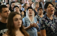 A farewell ceremony for Mykyta and Sofia Lamekhov and their son Lev at a church in Sloviansk