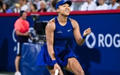 Japan's Naomi Osaka celebrates a victory against Clara Tauson of Denmark in the semi-finals of the WTA Canadian Open in Montreal