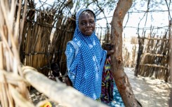 A young Chadian poses for a photograph at the Kiskra site for internally displaced people