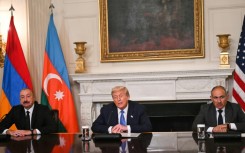 US President Donald Trump at the signing with Azerbaijani President Ilham Aliyev (L) and Armenian Prime Minister Nikol Pashinyan (R)